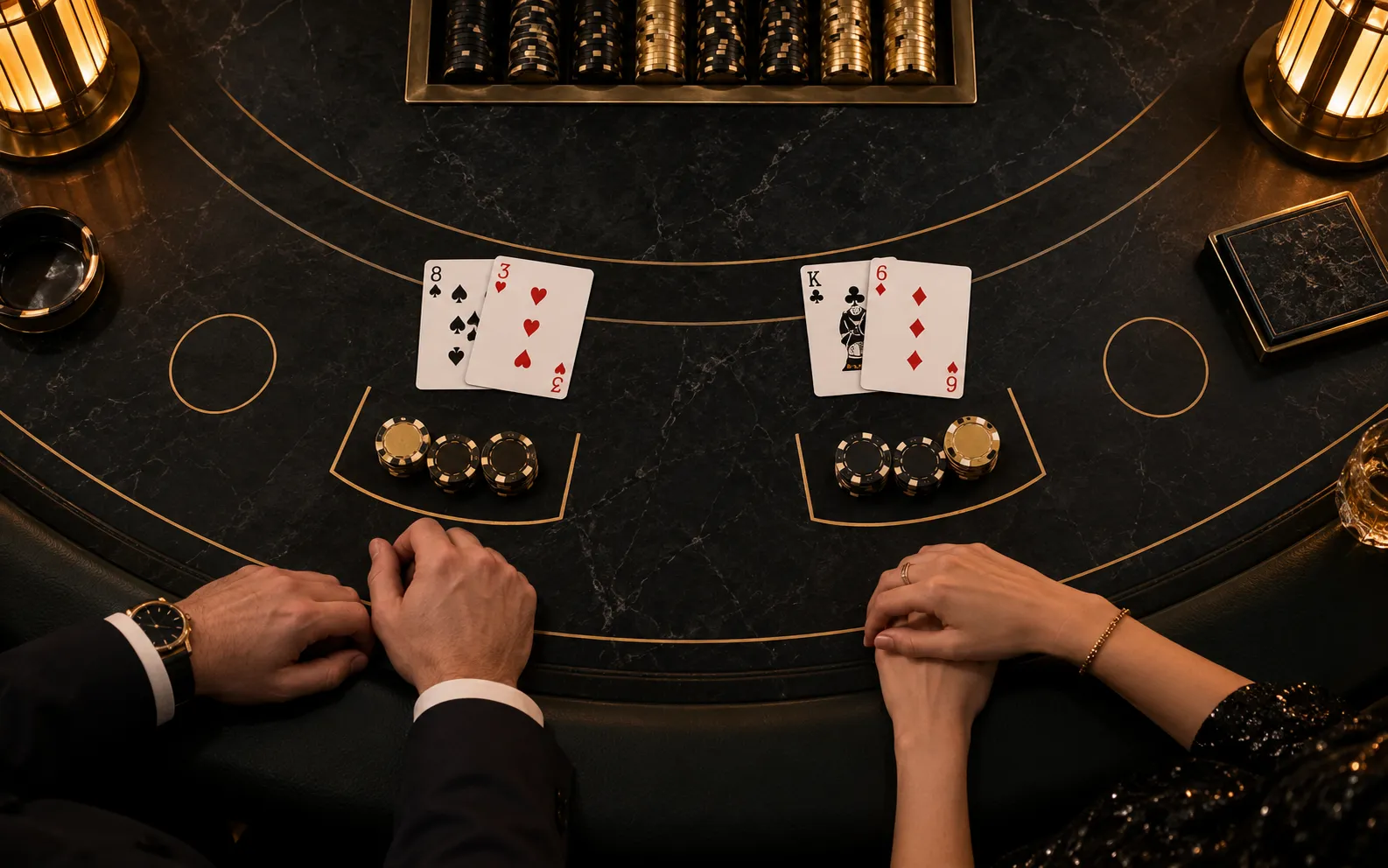 Top-down editorial visualisation of cards and chips on black stone